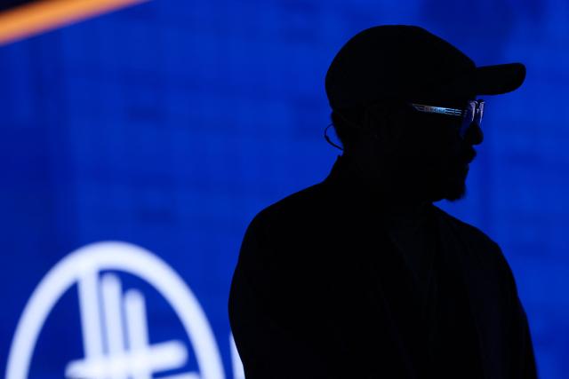 US musician and tech entrepreneur Will.i.am stands on stage in front of the Milken logo after speaking during the 29th annual Milken Institute Global Conference at the Beverly Hilton in Beverly Hills, California on May 5, 2026. (Photo by Patrick T. Fallon / AFP)