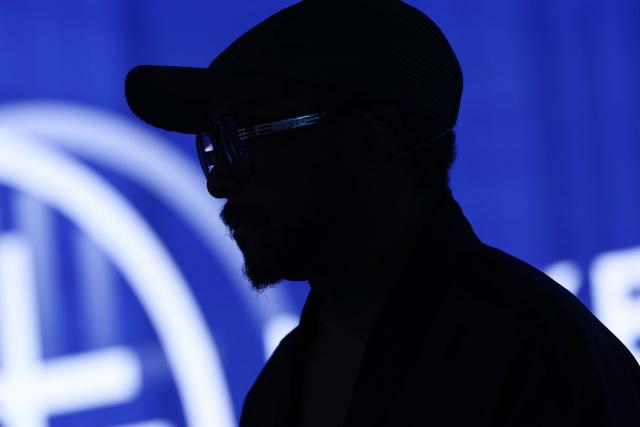US musician and tech entrepreneur Will.i.am stands on stage in front of the Milken logo after speaking during the 29th annual Milken Institute Global Conference at the Beverly Hilton in Beverly Hills, California on May 5, 2026. (Photo by Patrick T. Fallon / AFP)