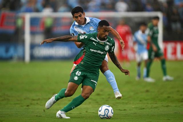 Sporting Cristal's forward #11 Irven Avila and Palmeiras' forward #40 Allan fight for the ball during the Copa Libertadores group stage football match between Peru's Sporting Cristal and Brazil's Palmeiras at the Nacional stadium in Lima on May 5, 2026. (Photo by ERNESTO BENAVIDES / AFP)