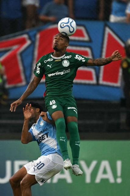 Palmeiras' forward #40 Allan heads the ball over Sporting Cristal's Brazilian defender #90 Cristiano da Silva during the Copa Libertadores group stage football match between Peru's Sporting Cristal and Brazil's Palmeiras at the Nacional stadium in Lima on May 5, 2026. (Photo by ERNESTO BENAVIDES / AFP)