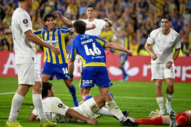 Rosario Central's defender #46 Ignacio Ovando celebrates scoring his team's first goal during the Copa Libertadores group stage football match between Argentina's Rosario Central and Paraguay's Libertad at the Gigante de Arroyito stadium in Rosario, Santa Fe province, Argentina on May 5, 2026. (Photo by Marcelo Manera / AFP)
