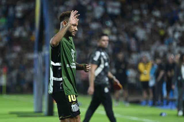 Santos' forward #10 Neymar greets fans ahead of the Copa Sudamericana group stage football match between Paraguay's Deportivo Recoleta and Brazil's Santos at the Rio Parapiti stadium in Pedro Juan Caballero, Paraguay, on May 5, 2026. (Photo by Daniel DUARTE / AFP)