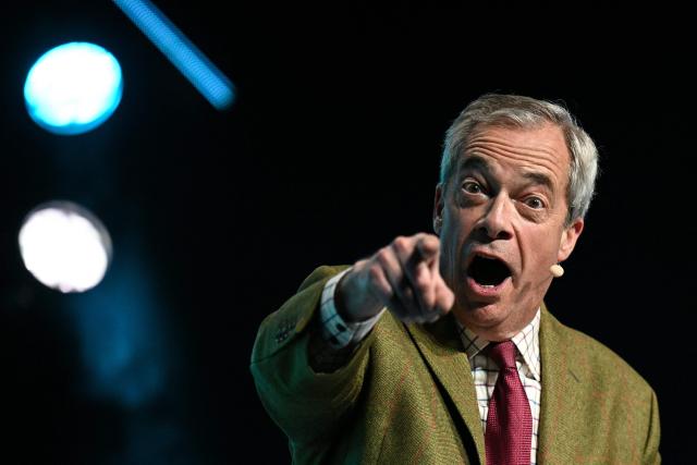 (FILES) Reform UK party leader Nigel Farage speaks during a local election campaign rally in Leeds, northern England on March 24, 2026. Political insurgents Reform UK are set to make huge gains in British local elections on May 7, 2026, as the far-right, anti-immigrant party draws increasing support from angry voters. (Photo by Oli SCARFF / AFP) / TO GO WITH Britain-vote-Reform,FOCUS by Marie Heuclin