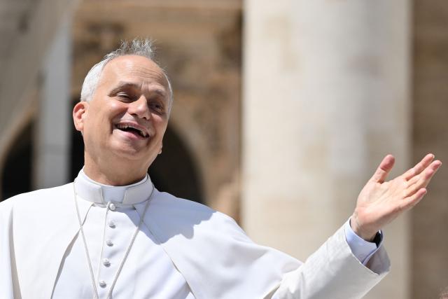 (FILES) Pope Leo XIV reacts at the end of a general audience at St. Peter’s square in the Vatican on July 30, 2025. On May 8, 2025, Robert Francis Prevost became the first North American pope under the name Leo XIV. In one year, he distinguished himself by a prudent and measured style, a strong social sensitivity and a firm desire to unify the Church. (Photo by Alberto PIZZOLI / AFP)
