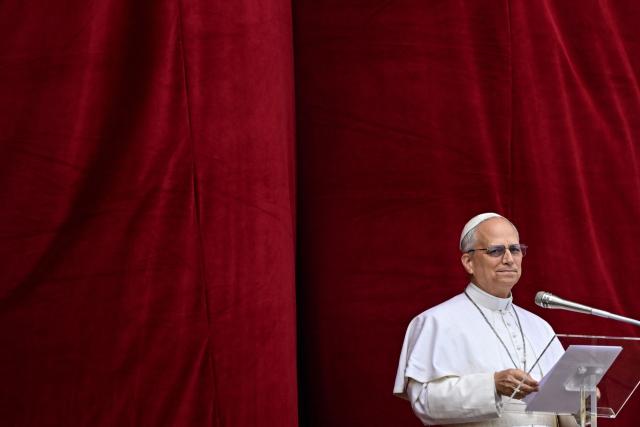 (FILES) Pope Leo XIV delivers the Regina Caeli prayer from the main central loggia of St Peter's basilica in The Vatican, on May 11, 2025. On May 8, 2025, Robert Francis Prevost became the first North American pope under the name Leo XIV. In one year, he distinguished himself by a prudent and measured style, a strong social sensitivity and a firm desire to unify the Church. (Photo by Tiziana FABI / AFP)
