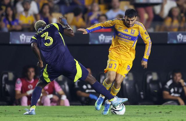 Nashville's Ghanaian defender #03 Maxwell Woledzi and Tigres' Argentine forward #07 Angel Correa fight for the ball during the CONCACAF Champions Cup semifinal second leg football match between Mexico's Tigres and US' Nashville SC at Universitario de la UANL stadium in San Nicolas de los Garza, Nuevo Leon state, Mexico, on May 5, 2026. (Photo by Julio Cesar AGUILAR / AFP)