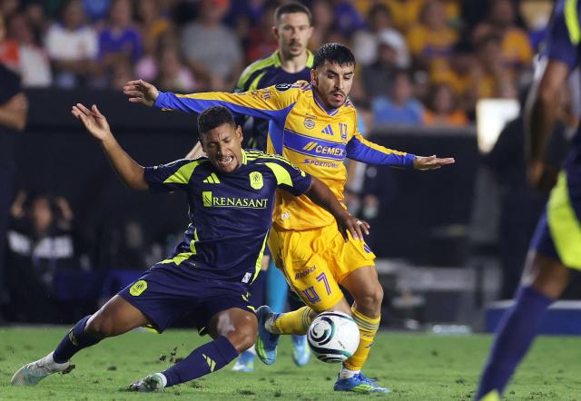 Nashville's Honduran midfielder #06 Bryan Acosta and Tigres' Argentine forward #07 Angel Correa fight for the ball during the CONCACAF Champions Cup semifinal second leg football match between Mexico's Tigres and US' Nashville SC at Universitario de la UANL stadium in San Nicolas de los Garza, Nuevo Leon state, Mexico, on May 5, 2026. (Photo by Julio Cesar AGUILAR / AFP)