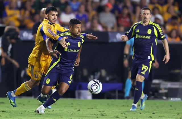 Nashville's Honduran midfielder #06 Bryan Acosta and Tigres' Argentine forward #07 Angel Correa fight for the ball during the CONCACAF Champions Cup semifinal second leg football match between Mexico's Tigres and US' Nashville SC at Universitario de la UANL stadium in San Nicolas de los Garza, Nuevo Leon state, Mexico, on May 5, 2026. (Photo by Julio Cesar AGUILAR / AFP)