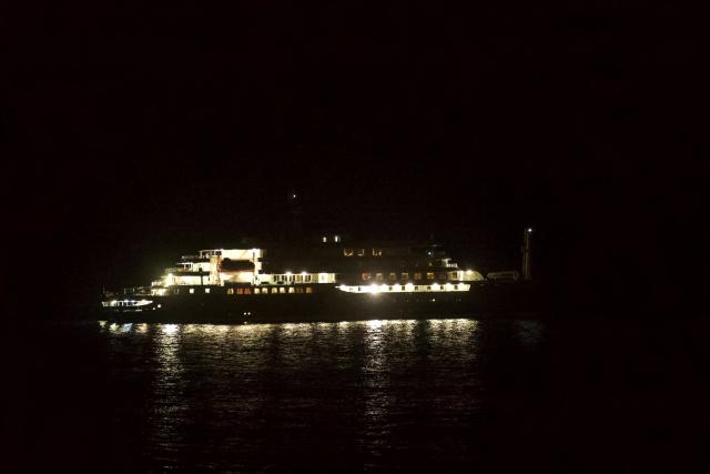 A general view of the cruise ship MV Hondius, while stationary off the port of Praia, the capital of Cape Verde, on May 6, 2026. Two seriously ill crew members on a cruise ship stricken by a deadly hantavirus outbreak will be evacuated via Cape Verde to the Netherlands, allowing the vessel to sail on to Spain's Canary Islands, the ship operator said Tuesday.
The MV Hondius has been at the centre of an international health scare since Saturday, when WHO was informed that the rare disease -- usually spread from infected rodents typically through urine, droppings and saliva -- was suspected of being behind the deaths of three of its passengers.
As others fell ill, passengers and crew have been in isolation after Cape Verde authorities barred the ship from docking, and as health authorities scrambled to find a port that would take the Hondius. (Photo by AFP)