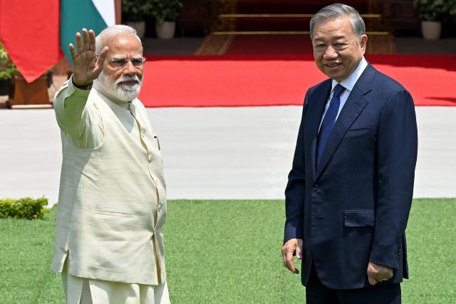 India's Prime Minister Narendra Modi (L) gestures next to Vietnam's President To Lam before their meeting at the Hyderabad House in New Delhi on May 6, 2026. (Photo by Sajjad HUSSAIN / AFP)