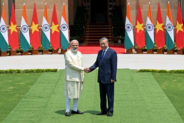 India's Prime Minister Narendra Modi (L) shakes hands with Vietnam's President To Lam before their meeting at the Hyderabad House in New Delhi on May 6, 2026. (Photo by Sajjad HUSSAIN / AFP)
