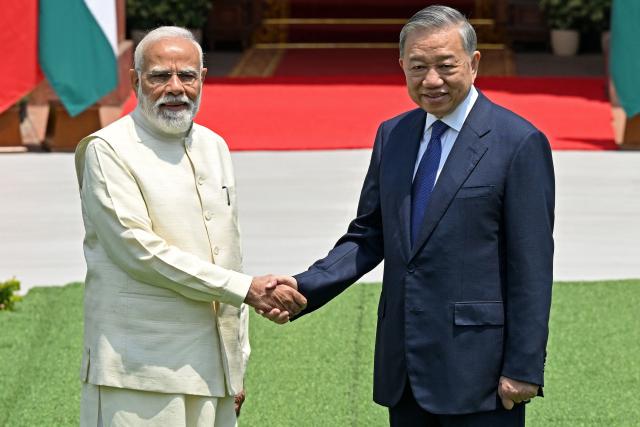 India's Prime Minister Narendra Modi (L) shakes hands with Vietnam's President To Lam before their meeting at the Hyderabad House in New Delhi on May 6, 2026. (Photo by Sajjad HUSSAIN / AFP)