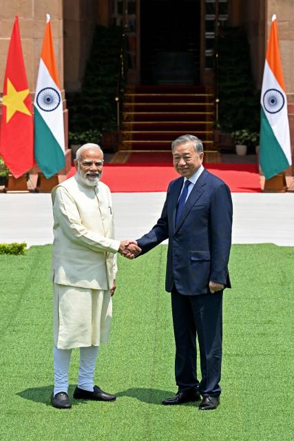 India's Prime Minister Narendra Modi (L) shakes hands with Vietnam's President To Lam before their meeting at the Hyderabad House in New Delhi on May 6, 2026. (Photo by Sajjad HUSSAIN / AFP)