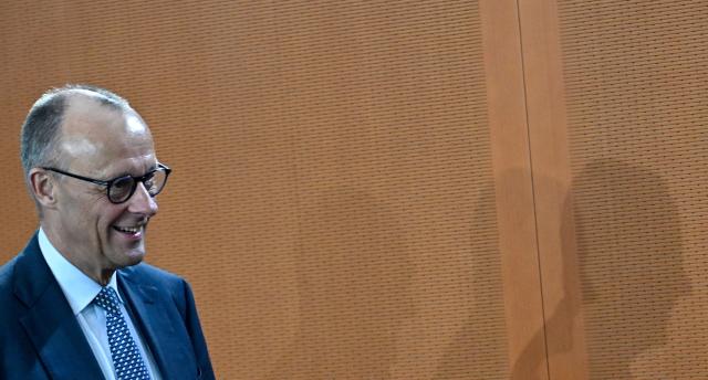 German Chancellor Friedrich Merz arrives for the weekly meeting of the German cabinet at the chancellery in Berlin on May 6, 2026. (Photo by Tobias SCHWARZ / AFP)