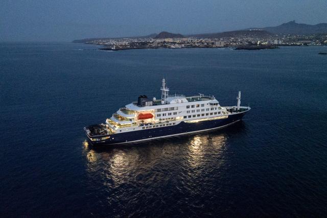 A general view of the cruise ship MV Hondius, while stationary off the port of Praia, the capital of Cape Verde, on May 6, 2026. Two seriously ill crew members on a cruise ship stricken by a deadly hantavirus outbreak will be evacuated via Cape Verde to the Netherlands, allowing the vessel to sail on to Spain's Canary Islands, the ship operator said on May 5, 2026.
The MV Hondius has been at the centre of an international health scare since Saturday, when WHO was informed that the rare disease -- usually spread from infected rodents typically through urine, droppings and saliva -- was suspected of being behind the deaths of three of its passengers.
As others fell ill, passengers and crew have been in isolation after Cape Verde authorities barred the ship from docking, and as health authorities scrambled to find a port that would take the Hondius. (Photo by AFP)