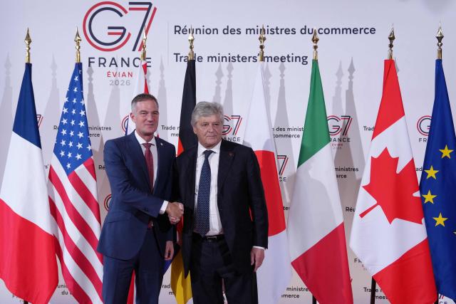 France’s Trade Minister Nicolas Forissier (R) welcomes Britain's Secretary of State for Business and Trade Peter Kyle for a meeting of the G7 countries in preparation for the summit of heads of State and government to be held in June in Evian, in Paris on May 6, 2026. (Photo by Aurelien Morissard / POOL / AFP)