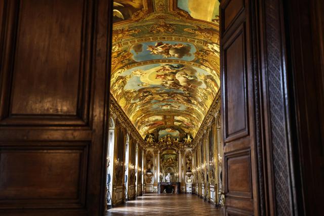 This photograph shows golden decorations, paintings and ornamental sculptures inside the golden hall of the Banque de France, the French central bank, at the Hotel de Toulouse building, in Paris on May 6, 2026. (Photo by Anne-Christine POUJOULAT / AFP)
