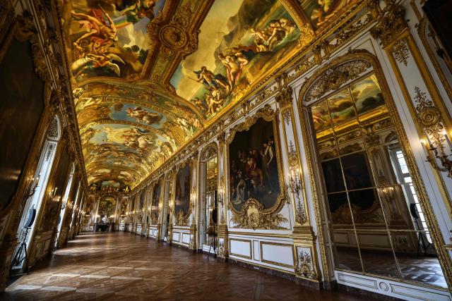 This photograph shows golden decorations, paintings and ornamental sculptures inside the golden hall of the Banque de France, the French central bank, at the Hotel de Toulouse building, in Paris on May 6, 2026. (Photo by Anne-Christine POUJOULAT / AFP)