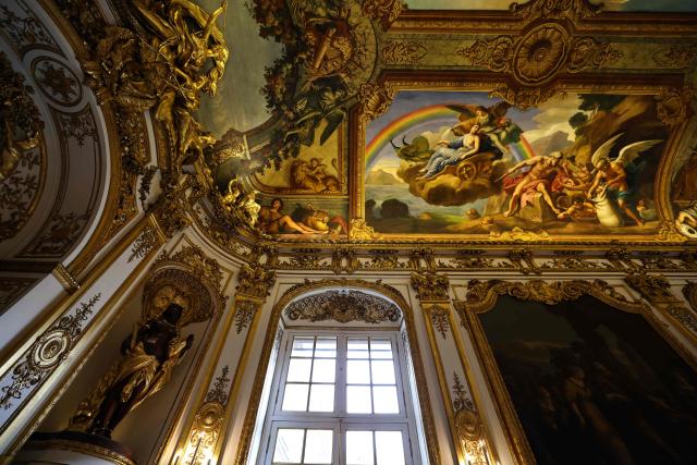 This photograph shows golden decorations, paintings and ornamental sculptures inside the golden hall of the Banque de France, the French central bank, at the Hotel de Toulouse building, in Paris on May 6, 2026. (Photo by Anne-Christine POUJOULAT / AFP)