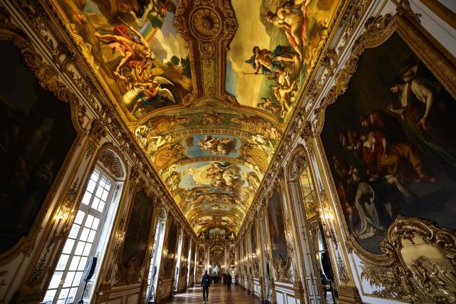 This photograph shows golden decorations, paintings and ornamental sculptures inside the golden hall of the Banque de France, the French central bank, at the Hotel de Toulouse building, in Paris on May 6, 2026. (Photo by Anne-Christine POUJOULAT / AFP)