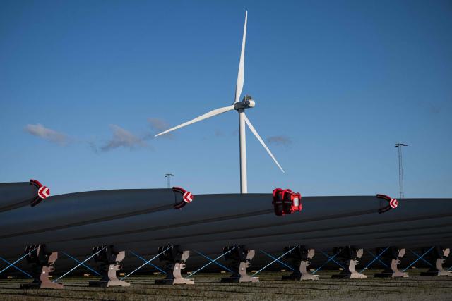(FILES) Wind turbine blades of Vestas, a global leader in sustainable energy solutions, are pictured at the Port of Odense, Denmark on October 15, 2024. Denmark's Vestas, Europe's leading wind turbine manufacturer, on May 6, 2026 posted a net profit of 70 million euro ($82 million) for the first quarter, and said it had a "record" number of orders. (Photo by Jonathan NACKSTRAND / AFP)