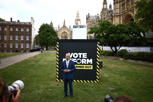 Reform UK leader Nigel Farage takes part in a photo call at College Green, Westminster in central London on May 6, 2026, a day before British local elections. British voters head to the polls on May 7 for local elections set to pile more misery on unpopular Labour Prime Minister Keir Starmer and cement the rise of right- and left-wing populists. (Photo by Henry NICHOLLS / AFP)