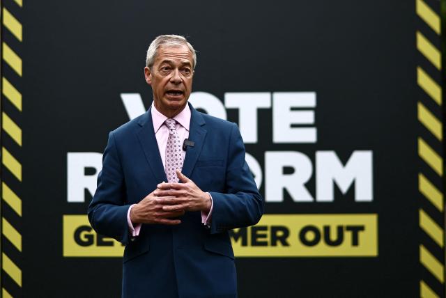 Reform UK leader Nigel Farage takes part in a photo call at College Green, Westminster in central London on May 6, 2026, a day before British local elections. British voters head to the polls on May 7 for local elections set to pile more misery on unpopular Labour Prime Minister Keir Starmer and cement the rise of right- and left-wing populists. (Photo by Henry NICHOLLS / AFP)