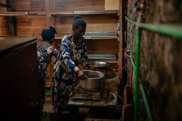 A woman uses biogas in her small bakery, notably to cook beans in Goma on April 20, 2026. Most of the city's nearly one million people cannot afford to use electricity and mostly depend on charcoal, called makala, for cooking and heating.
Some people are switching to biogas, a renewable energy source that is cheaper and locally produced.
Biogas is produced by the decomposition of organic matter.
It has been made in Goma since 2016 by Umoja, a local company whose stated aim is to offer an alternative to firewood, which destroys forests. (Photo by Jospin Mwisha / AFP)