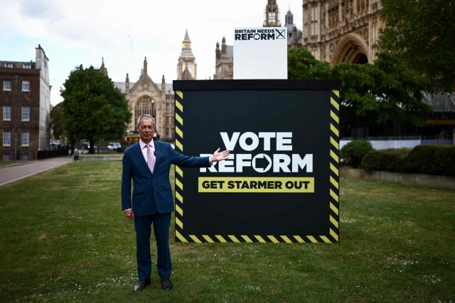 Reform UK leader Nigel Farage takes part in a photo call at College Green, Westminster in central London on May 6, 2026, a day before British local elections. British voters head to the polls on May 7 for local elections set to pile more misery on unpopular Labour Prime Minister Keir Starmer and cement the rise of right- and left-wing populists. (Photo by Henry NICHOLLS / AFP)