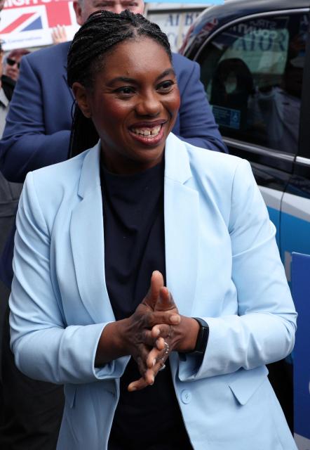 Britain's main opposition Conservative Party leader Kemi Badenoch, reacts as she arrives in Croydon, as part of her "branded taxi tour" around various points across the capital, in south London on May 6, 2026, a day before British local elections. British voters head to the polls on May 7 for local elections set to pile more misery on unpopular Labour Prime Minister Keir Starmer and cement the rise of right- and left-wing populists. (Photo by Adrian DENNIS / AFP)