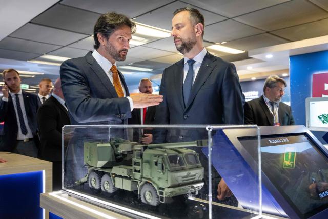 Poland's Deputy Prime Minister and Defence Minister Wladyslaw Kosiniak-Kamysz (C-R) and Slovakia's Deputy Prime Minister and Defence Minister Robert Kalinak visit a stand of a Slovak arms company at the "Defence24 Days" – a conference on defence and security attended by various leaders and experts from the region, in Warsaw, Poland, on May 6, 2026. (Photo by Wojtek RADWANSKI / AFP)