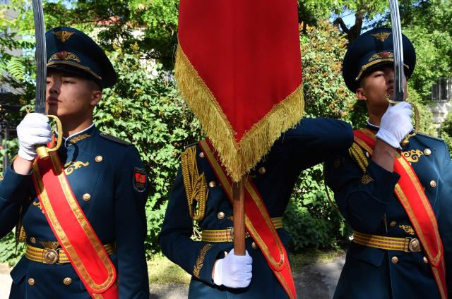 Kyrgyz honour guards stand at attention as military officials congratulate World War Two veterans as part of the Victory Day celebrations in Bishkek on May 6, 2026. Kyrgyzstan will celebrate the 81st anniversary of the Soviet Union's victory over Nazi Germany on May 9. (Photo by Vyacheslav OSELEDKO / AFP)