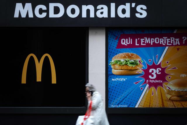 A pedestrian walks past a McDonald's food chain restaurant in Paris on May 6, 2026. (Photo by JOEL SAGET / AFP)
