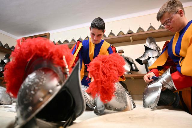 New Swiss Guards, responsible for protecting the pope, prepare their gear at the Vatican Armoury of the Pontifical Swiss Guard headquarters before the swearing-in ceremony of new Swiss Guard recruits at the Vatican, on May 6, 2026. (Photo by Alberto PIZZOLI / AFP)