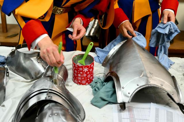 New Swiss Guards, responsible for protecting the pope, prepare their gear at the Vatican Armoury of the Pontifical Swiss Guard headquarters before the swearing-in ceremony of new Swiss Guard recruits at the Vatican, on May 6, 2026. (Photo by Alberto PIZZOLI / AFP)