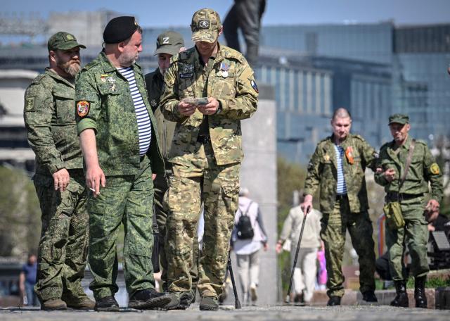 Russian veterans of the Russian-Ukrainian conflict walk outside the Museum of the Great Patriotic War (also known as the Victory Museum ) at Poklonnaya Hill in western Moscow on May 6, 2026, few days ahead of the Victory Day military parade, to be held at Red Square on May 9. Russia declared on May 4 a unilateral ceasefire with Ukraine between May 8-9, when Moscow marks its annual World War II Victory Day commemorations, and threatened a "massive missile strike" on Kyiv if Ukraine violated it. (Photo by Alexander NEMENOV / AFP)