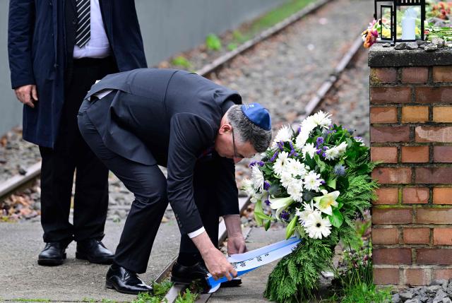 Israeli Foreign Minister Gideon Sa'ar arranges a wreath at the Platform 17 Memorial (Gleis 17) at Grunewald train station in Berlin, on May 06, 2026 to commemorate the thousands of Jews who were deported from Berlin on Deutsche Reichsbahn trains from this platform. From the fall of 1941 to the spring of 1942, approximately 10,000 German Jews were deported from here to labor and concentration camps in Riga, Warsaw, Auschwitz-Birkenau and Theresienstadt. (Photo by John MACDOUGALL / AFP)