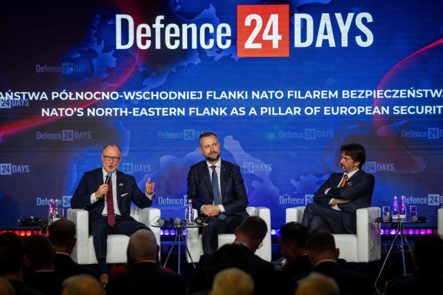 Latvia's Defence Minister Andris Spruds (L), Poland's Deputy Prime Minister and Defence Minister Wladyslaw Kosiniak-Kamysz (C) and Slovakia's Deputy Prime Minister and Defence Minister Robert Kalinak (R) take part in the panel discussion "NATO’s north-eastern flank as a pillar of European security" at "Defence24 Days" – a conference on defence and security attended by various leaders and experts from the region, in Warsaw, Poland, on May 6, 2026. (Photo by Wojtek RADWANSKI / AFP)