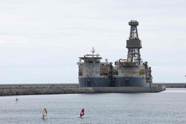 Windsurfers are pictured in the port of Granadilla de Abona on the island of Tenerife in Spain's Canary Islands on May 6, 2026. A cruise ship hit by a hantavirus outbreak will dock "within three days" at Granadilla on the island of Tenerife, Spains health minister said Wednesday, despite opposition from the Canary Islands regional government.
"A joint system for health assessment and evacuation will be put in place to repatriate all passengers, unless their medical condition prevents it," Health Minister Monica Garcia Gomez told a Madrid news conference. (Photo by Oscar DEL POZO / AFP)