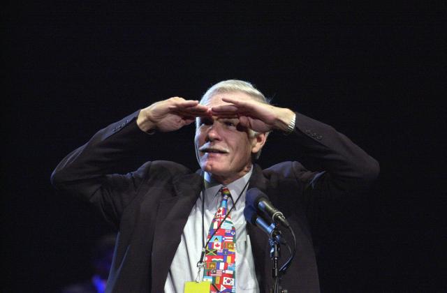 (FILES) Ted Turner, founder of CNN, acknowledges the crowd during CNN's 20th Anniversary bash June 1, 2000 at Philips Arena in Atlanta, Georgia. Ted Turner, who transformed television news with the creation of CNN in 1980, has died at the age of 87, the network said on May 6, 2026. Cable News Network upended established broadcasting with its dedication to around-the-clock breaking news and shot to global recognition with its coverage of the Gulf War in 1990-91. (Photo by Joey Ivansco / POOL / AFP)