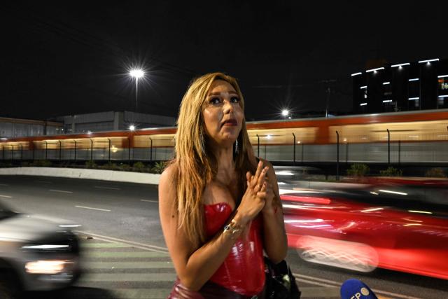 A sex worker who identified herself as Pamela, 40, speaks during an interview with AFP at Tlalpan Avenue —which leads to the Banorte Stadium, the venue for the opening ceremony of the upcoming World Cup— as she waits for clients in Mexico City on May 5, 2026. (Photo by Yuri CORTEZ / AFP)
