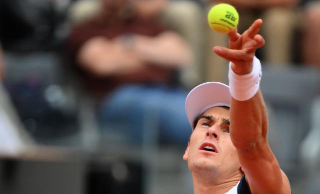 Italian Matteo Arnaldi serves to Spanish Jaume Munar during the ATP Rome Open tennis tournament at Foro Italico in Rome on May 6, 2026. (Photo by Tiziana FABI / AFP)