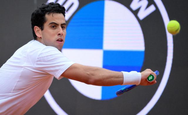 Spanish Jaume Munar hits a return to Italian Matteo Arnaldi during the ATP Rome Open tennis tournament at Foro Italico in Rome on May 6, 2026. (Photo by Tiziana FABI / AFP)