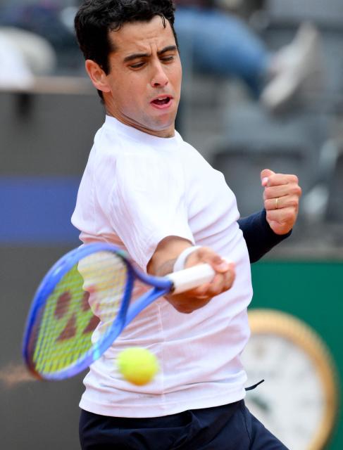 Spanish Jaume Munar hits a return to Italian Matteo Arnaldi during the ATP Rome Open tennis tournament at Foro Italico in Rome on May 6, 2026. (Photo by Tiziana FABI / AFP)