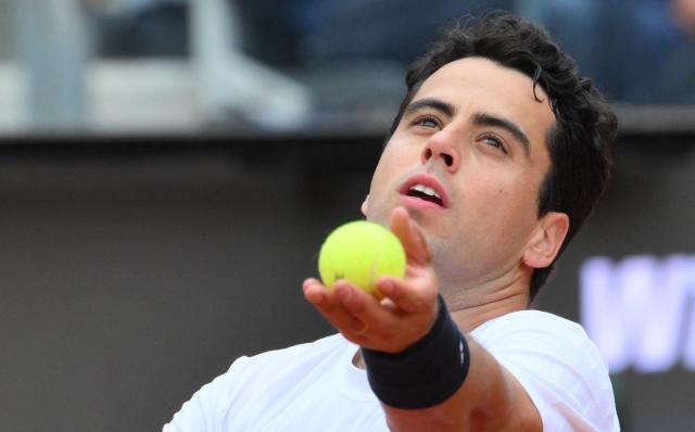 Spanish Jaume Munar serves to Italian Matteo Arnaldi during the ATP Rome Open tennis tournament at Foro Italico in Rome on May 6, 2026. (Photo by Tiziana FABI / AFP)