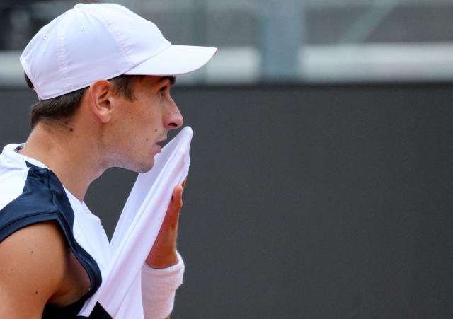 Italian Matteo Arnaldi hits a return to Spanish Jaume Munar during the ATP Rome Open tennis tournament at Foro Italico in Rome on May 6, 2026. (Photo by Tiziana FABI / AFP)