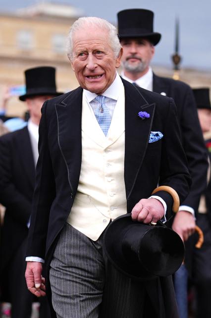 Britain's King Charles III reacts after meeting guests during a Royal Garden Party at Buckingham Palace, in London, on May 6, 2026. (Photo by Aaron Chown / POOL / AFP)