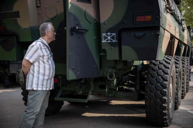 A visitor looks inside a Polish-made "Rosomak" APC (Armored Personnel Carrier) at the Exhibition of the Polish Armed Forces and the Polish Defence Industry during the "Defence24 Days" – a conference on defence and security attended by various leaders and experts from the region, in Warsaw, Poland, on May 6, 2026. (Photo by Wojtek RADWANSKI / AFP)