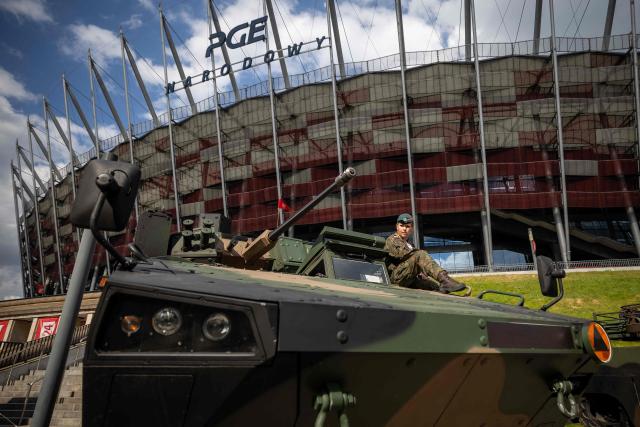 A Polish soldier sits atop a Polish-made "Rosomak" APC (Armored Personnel Carrier) at the Exhibition of the Polish Armed Forces and the Polish Defence Industry during the "Defence24 Days" – a conference on defence and security attended by various leaders and experts from the region, in Warsaw, Poland, on May 6, 2026. (Photo by Wojtek RADWANSKI / AFP)