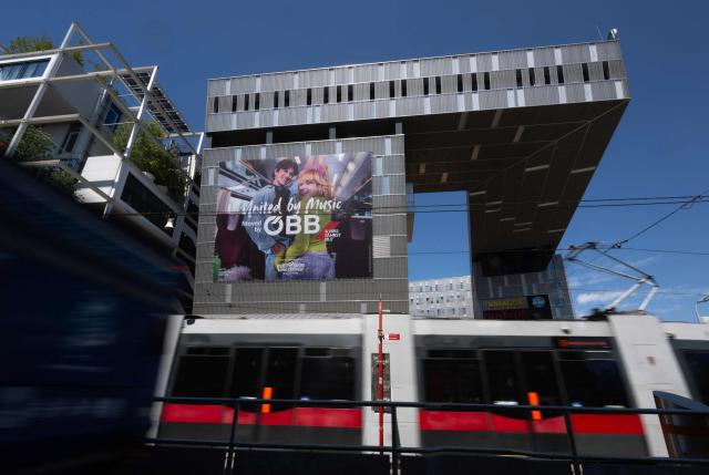 A 2026 Eurovision Song Contest poster, with the slogan "United by music" of the Austrian Federal Railways (OeBB), welcomes travelers at the Westbahnhof (West train station) in Vienna, Austria on May 06, 2026. (Photo by Joe Klamar / AFP)